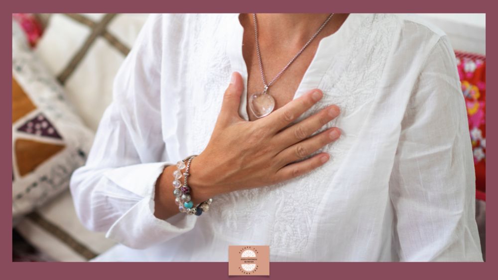 How to Calm a Stress Triggered Painful Eczema Flare - person in white top with hand resting over heart